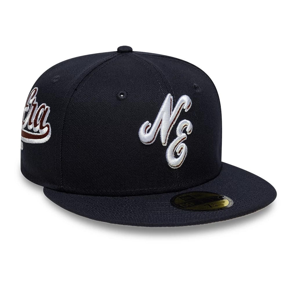 Pictured is this New Era Heritage Script 59FIFTY Fitted cap in navy. 1