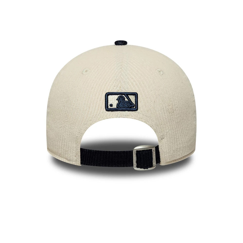 New York Yankees MLB Cord White & Black New Era 9FORTY M-Crown Adjustable Cap, rear view showing the navy embroidered MLB Batterman logo centred on the white cord fabric, with a black strap and buckle adjusting the fit.