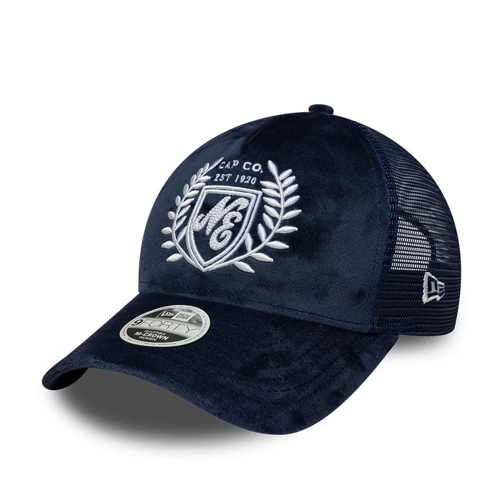 Pictured is this Womens New Era Velour 9FORTY M-Crown A-Frame Trucker cap in navy. 1