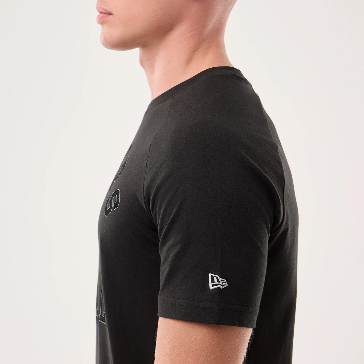 The model is wearing this NFL Sideline 2026 Las Vegas Raiders T-Shirt in black. 5