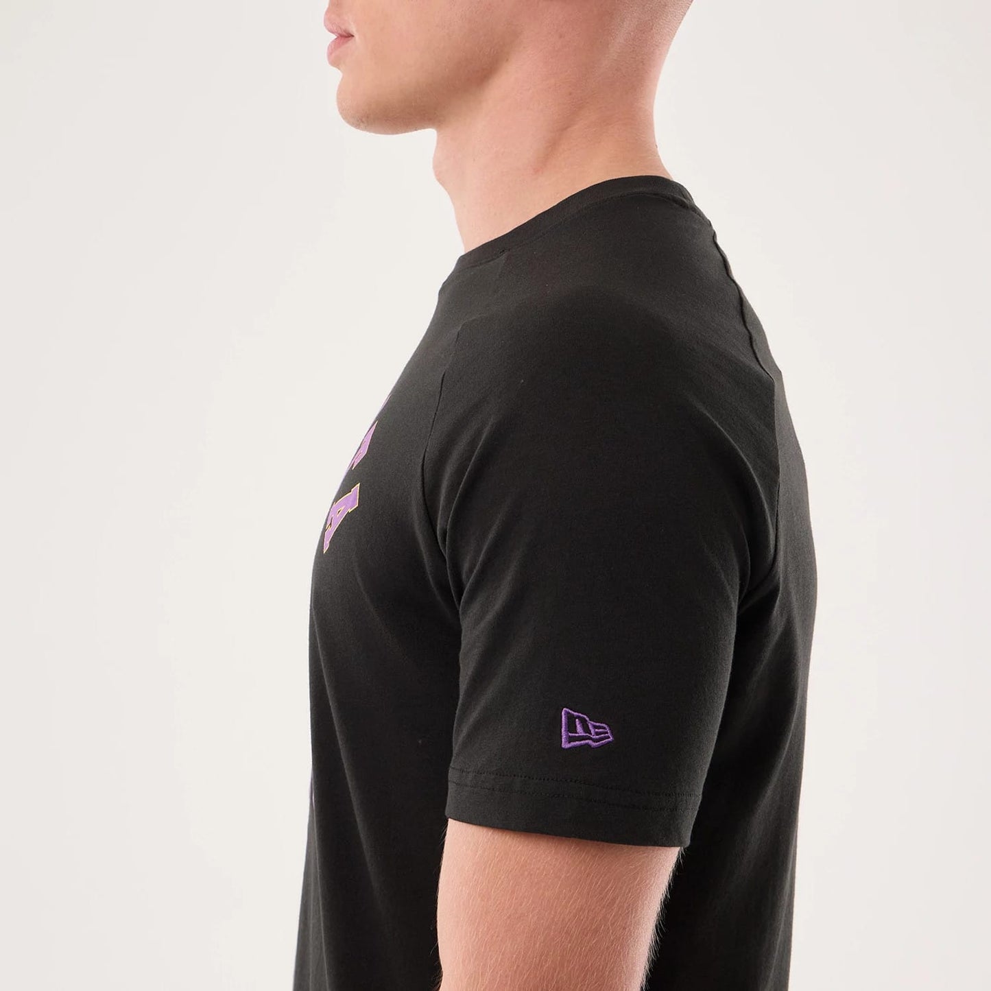 The model is wearing this NFL Sideline 2026 Minnesota Vikings T-Shirt in black. 7