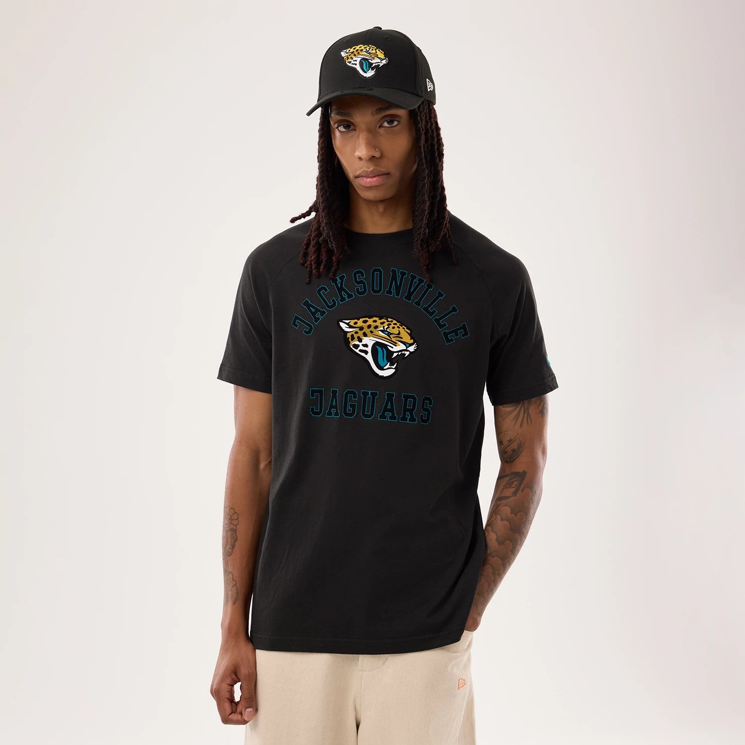 The model is wearing this NFL Sideline 2026 Jacksonville Jaguars T-Shirt in black. 1