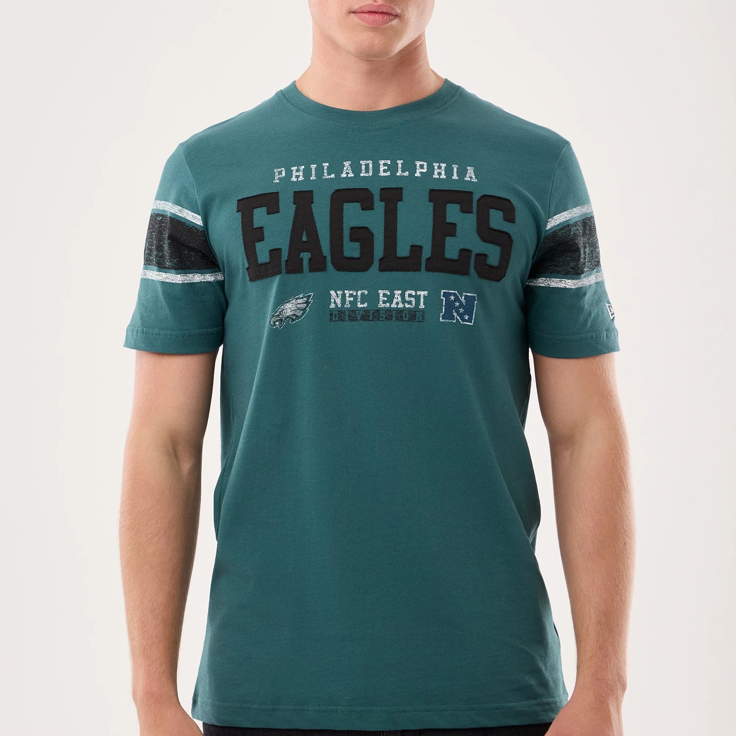 The model is wearing this NFL Sideline 2026 Philadelphia Eagles T-Shirt in dark green. 3