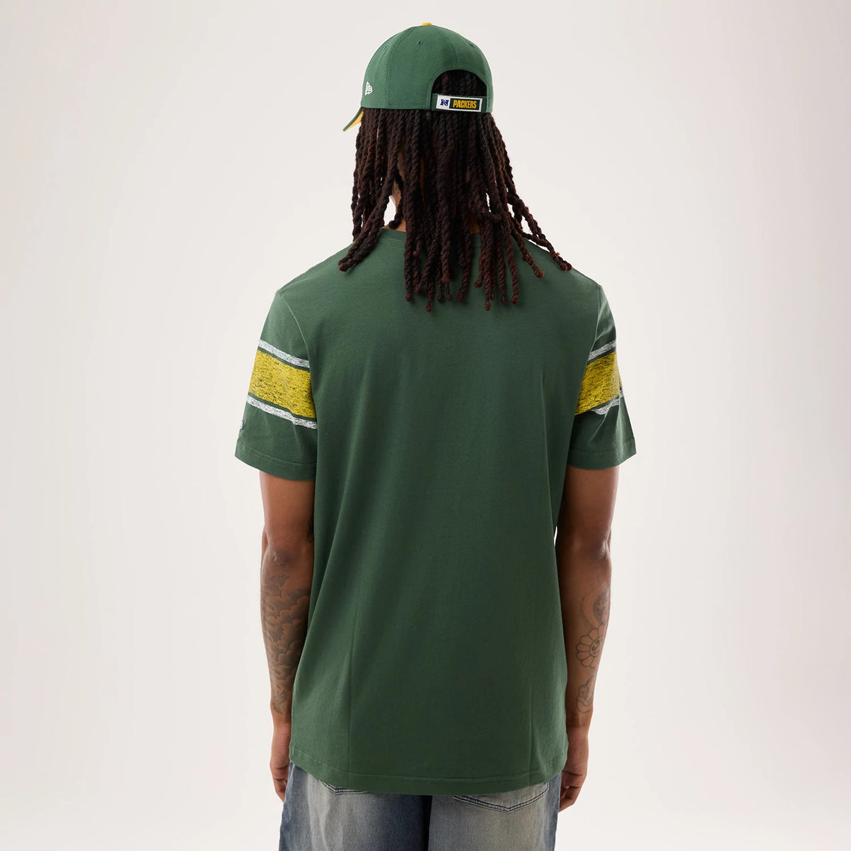 The model is wearing this NFL Sideline 2026 Green Bay Packers T-Shirt in dark green. 2