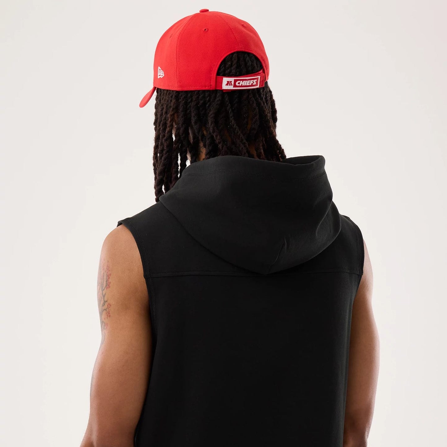 The model is wearing this NFL Sideline 2026 Kansas City Chiefs Tank Top in black. 7