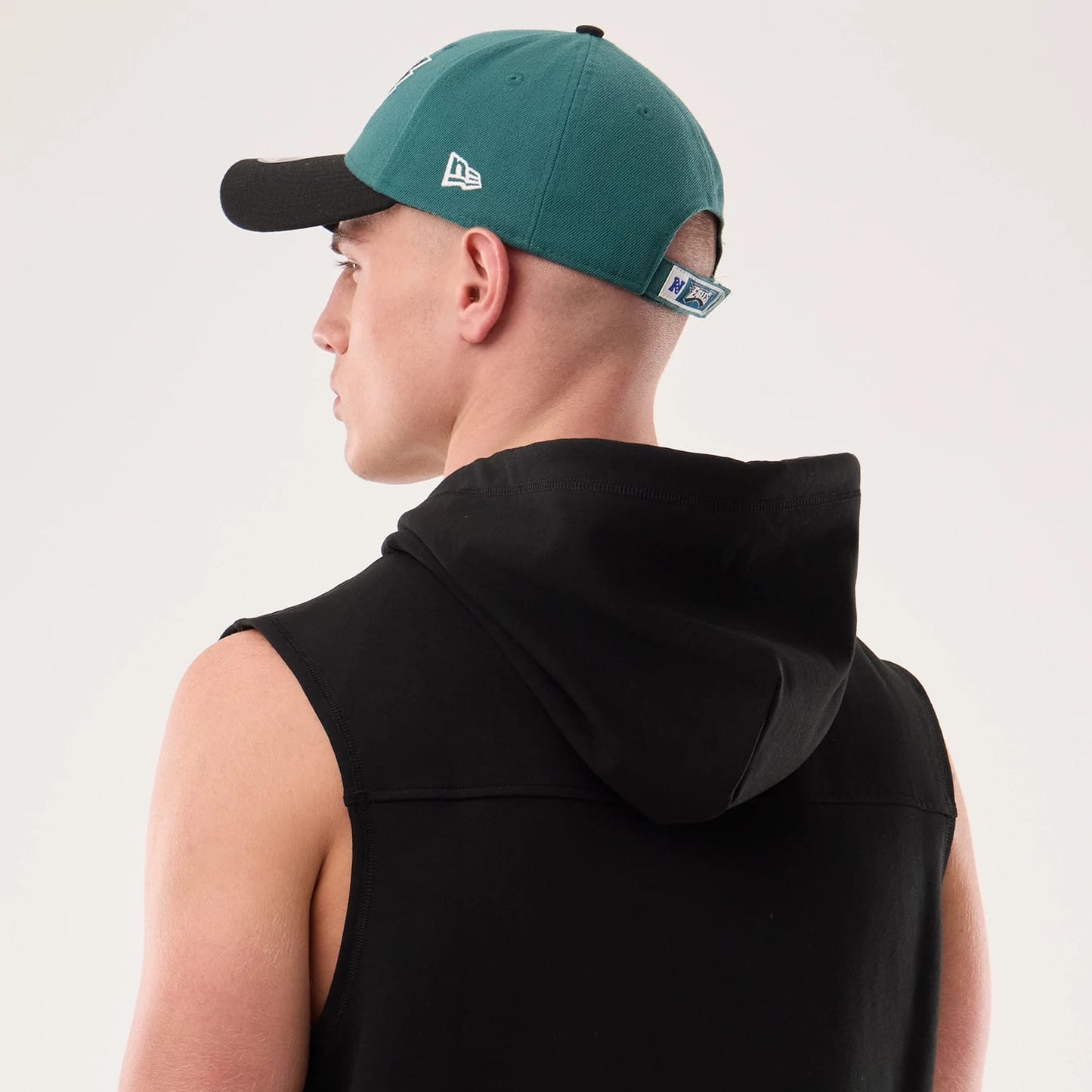 The model is wearing this NFL Sideline 2026 Philadelphia Eagles Tank Top in black. 7