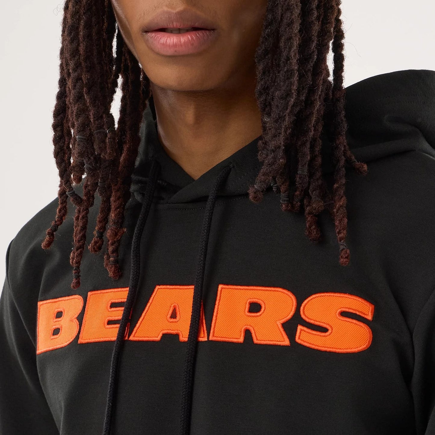 The model is wearing this NFL Sideline 2026 Chicago Bears Double Sleeve Hoodie in black. 7