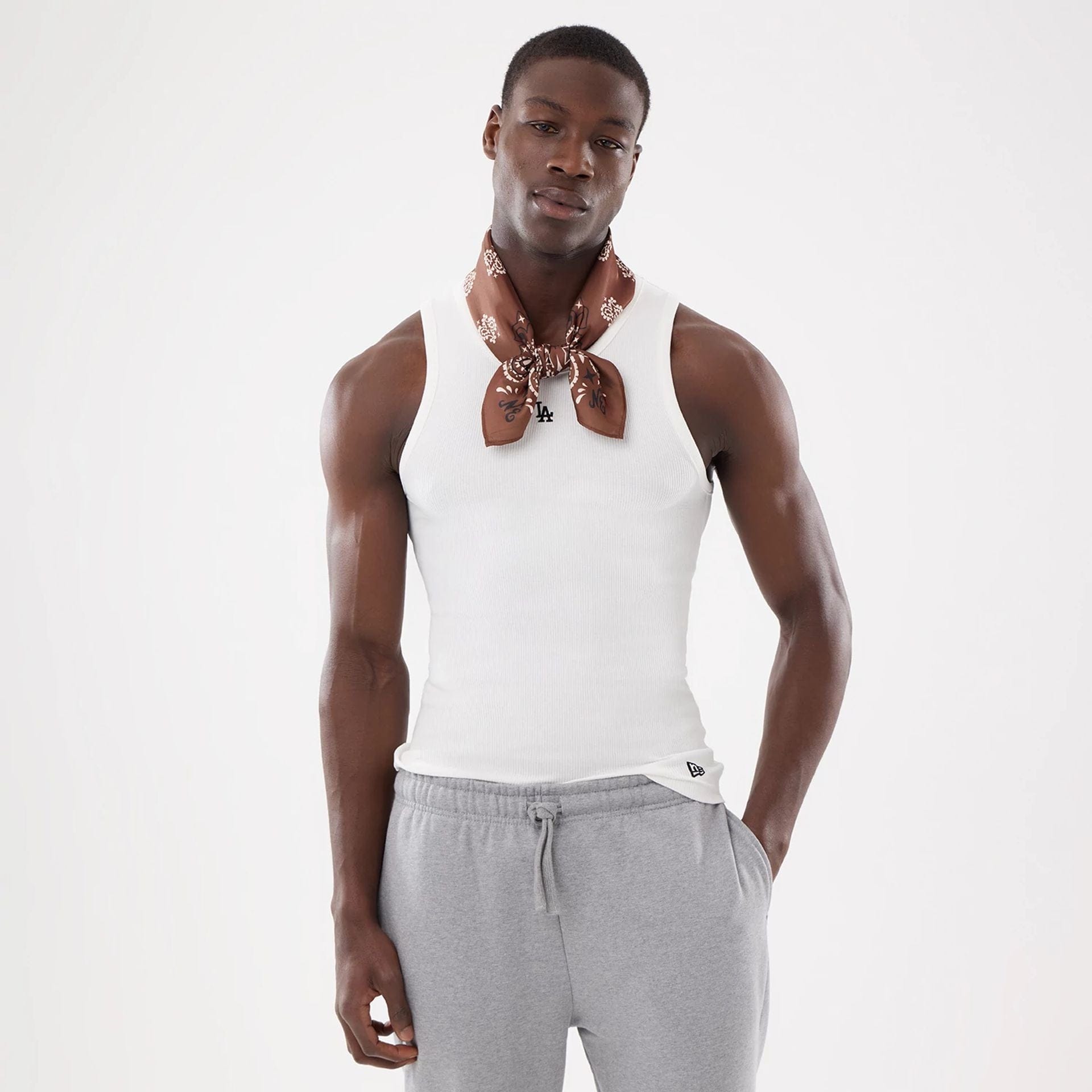 Pictured is this New Era Paisley Bandana in Brown. 2