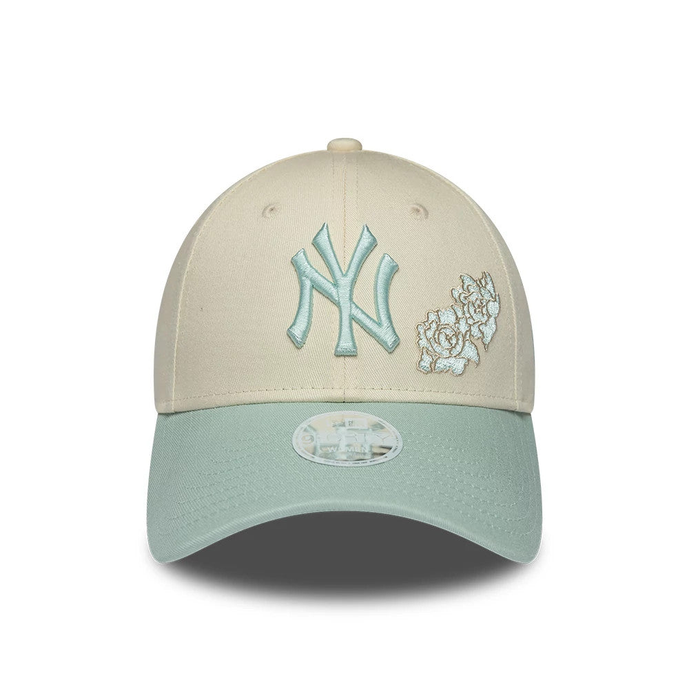 New York Yankees Womens MLB Floral Cream New Era 9FORTY Adjustable Cap, front view showing the light blue embroidered NY logo and floral design on the cream front panels, complemented by a mint green curved visor with a 9FORTY size sticker.