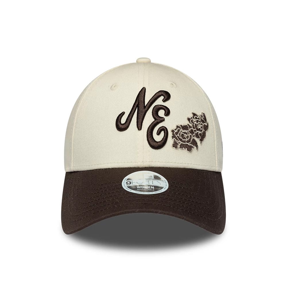 Womens New Era Floral Light Beige 9FORTY Adjustable Cap, front view showing the raised brown embroidered NE lettering and floral design on the light beige front panel, with a dark brown curved visor and 9FORTY size sticker.