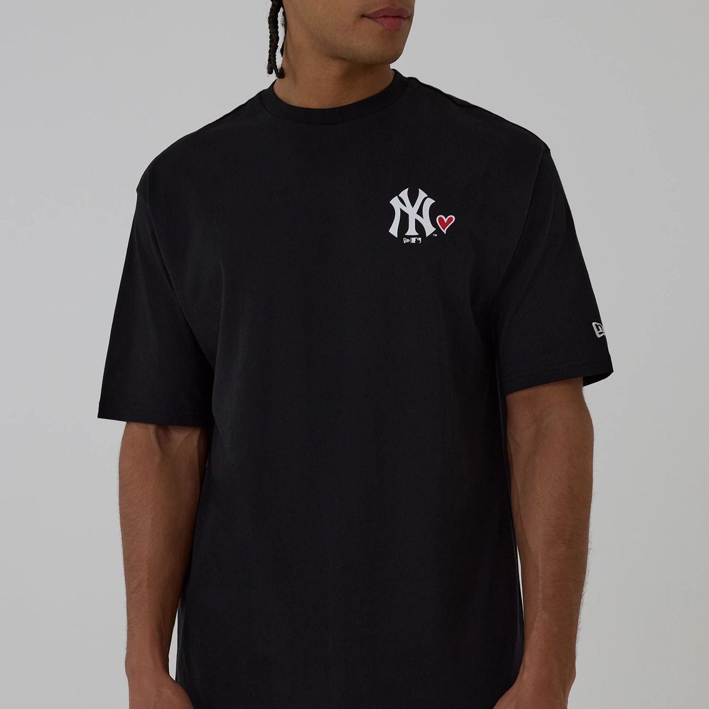 The model is wearing this MLB Heart Graphic New York Yankees T-Shirt in black. 7
