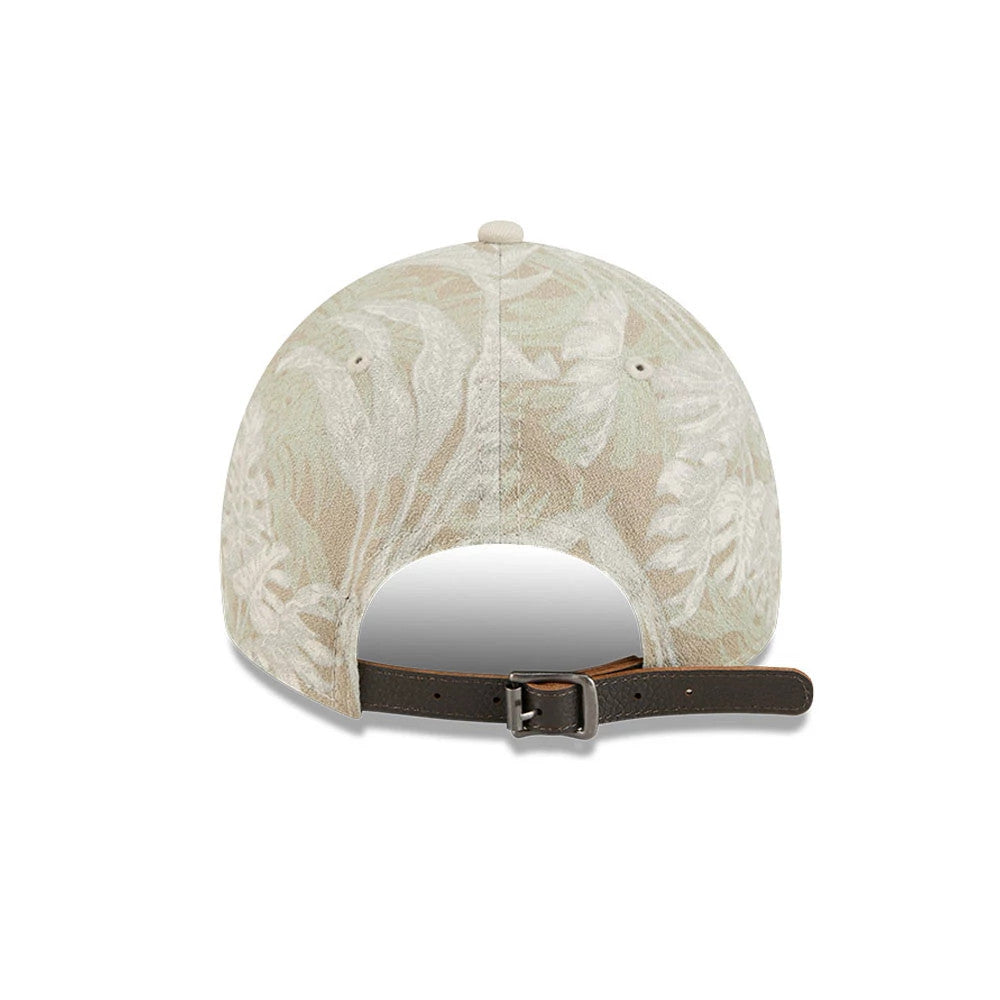 LA Dodgers MLB Leafy Palm Light Beige New Era 9TWENTY Adjustable Cap, rear view showing a leafy palm pattern across the crown, with a light beige top button, matching embroidered eyelets, and a dark brown adjustable strap with a buckle.