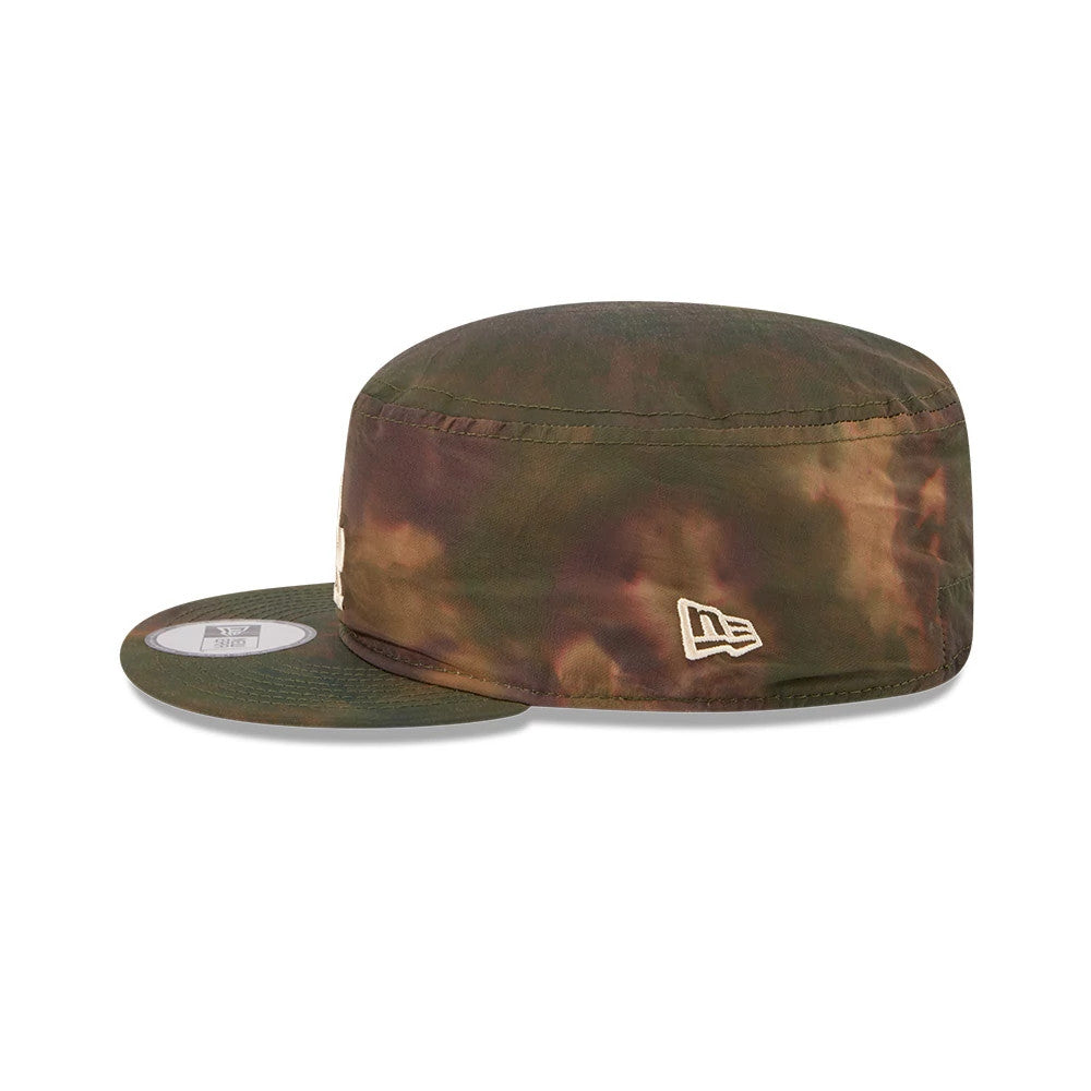 New Era LA Dodgers MLB Nylon Wash Dye Open Green Painter Cap, side view showing the cream New Era flag logo on the left side of the structured cap, with a flat visor and a tie-dye effect in shades of green and brown.