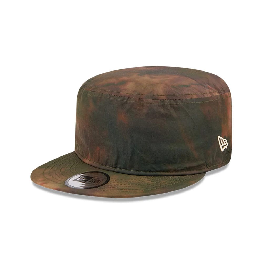 New Era Nylon Wash Dye Open Green Painter Cap, three-quarter view showing the green tie-dye pattern on the crown and flat visor, the New Era flag logo embroidered in white on the left side, and the black 9FORTY size sticker on the visor.
