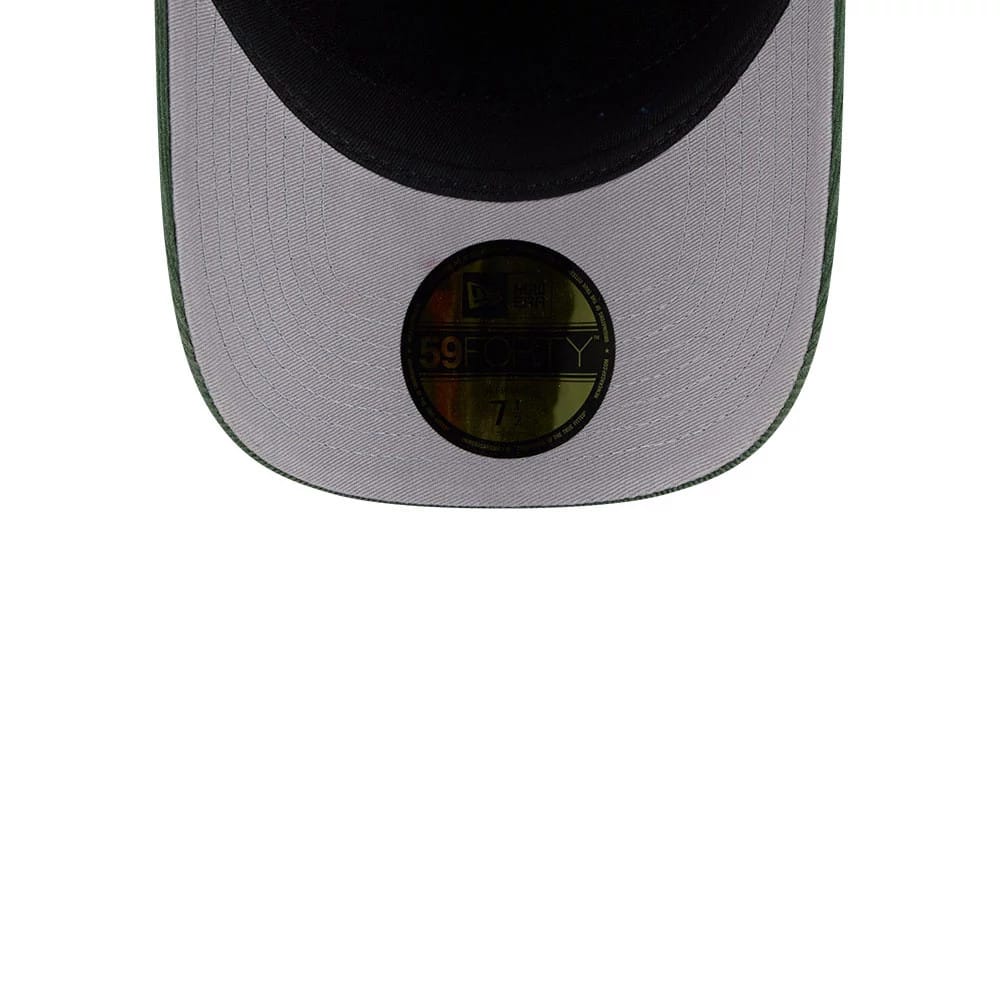 Pictured is this MLB Quickstrike Snow Wash Cord Athletics 59FORTY A-Frame Fitted cap in dark green. 2