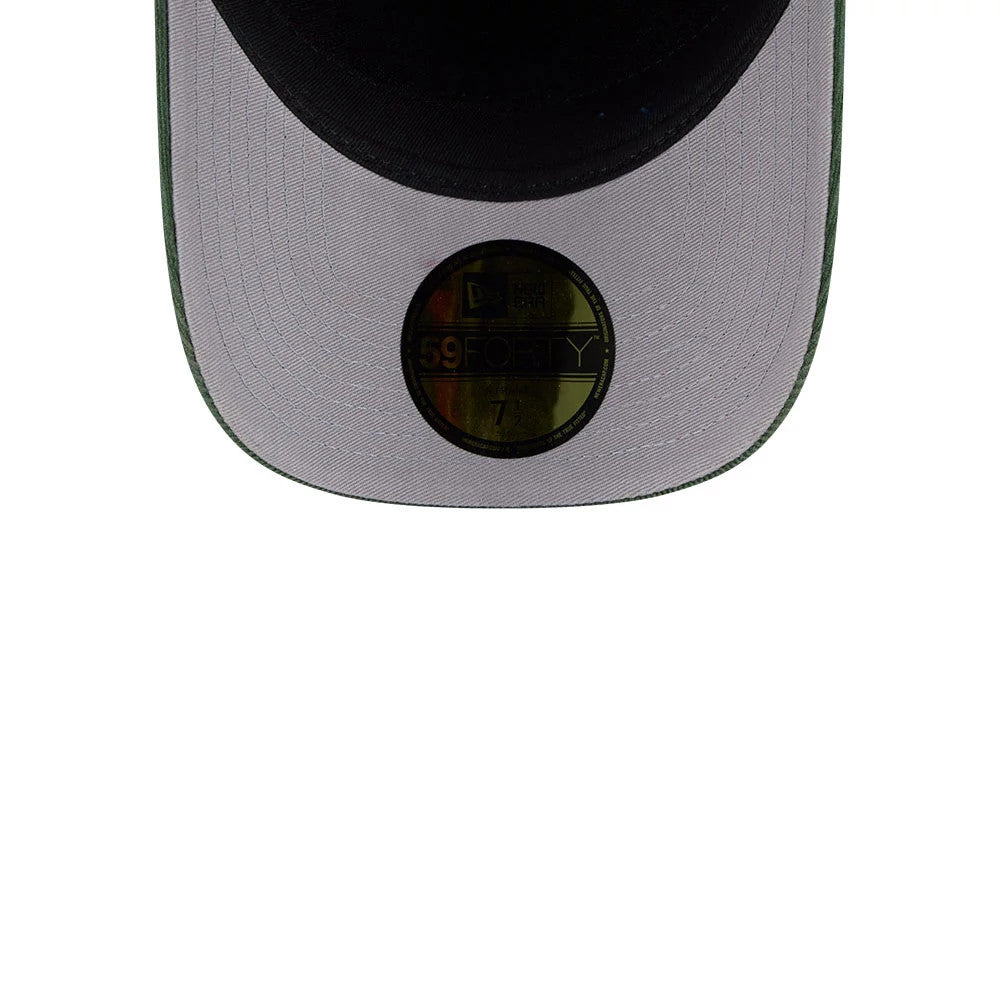Athletics MLB Snow Wash Cord Dark Green New Era 59FORTY A-Frame Fitted Cap, inside view showing a grey undervisor with detailed stitching, the black interior sweatband, and the gold 59FORTY size sticker prominently placed on the undervisor.