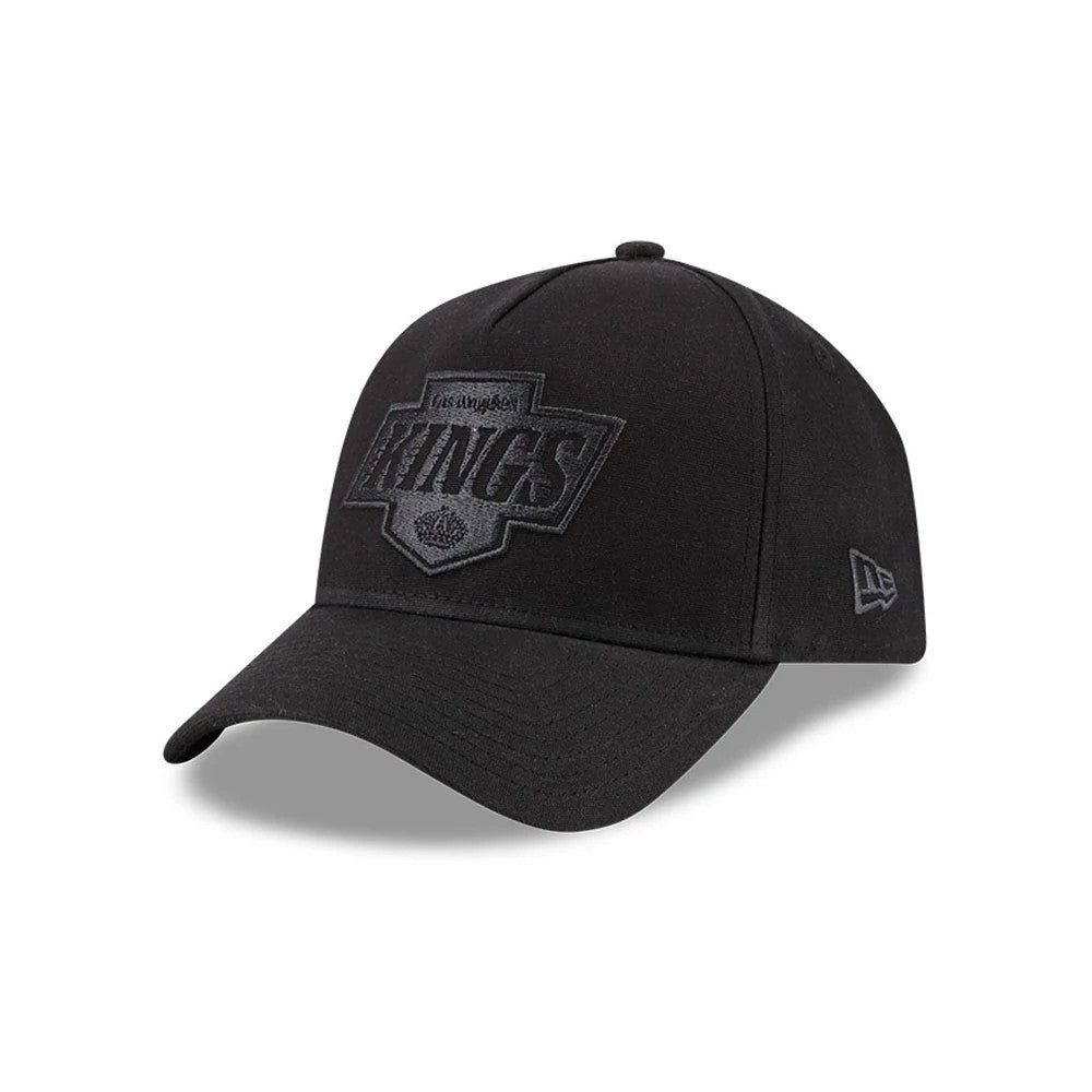 Kings NHL Waxy Canvas Black New Era 59FORTY A-Frame Fitted Cap, three-quarter view showing the black embroidered Kings badge logo on the structured front panel, with a pre-curved black visor and the New Era flag logo on the left side.