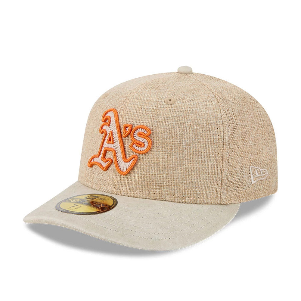 Athletics MLB Halloween Beige New Era 59FIFTY Fitted Cap, three-quarter view showing orange raised embroidered A's logo on the front panel, contrasting beige curved visor, gold 59FIFTY size sticker on the visor and New Era flag logo on the left side.
