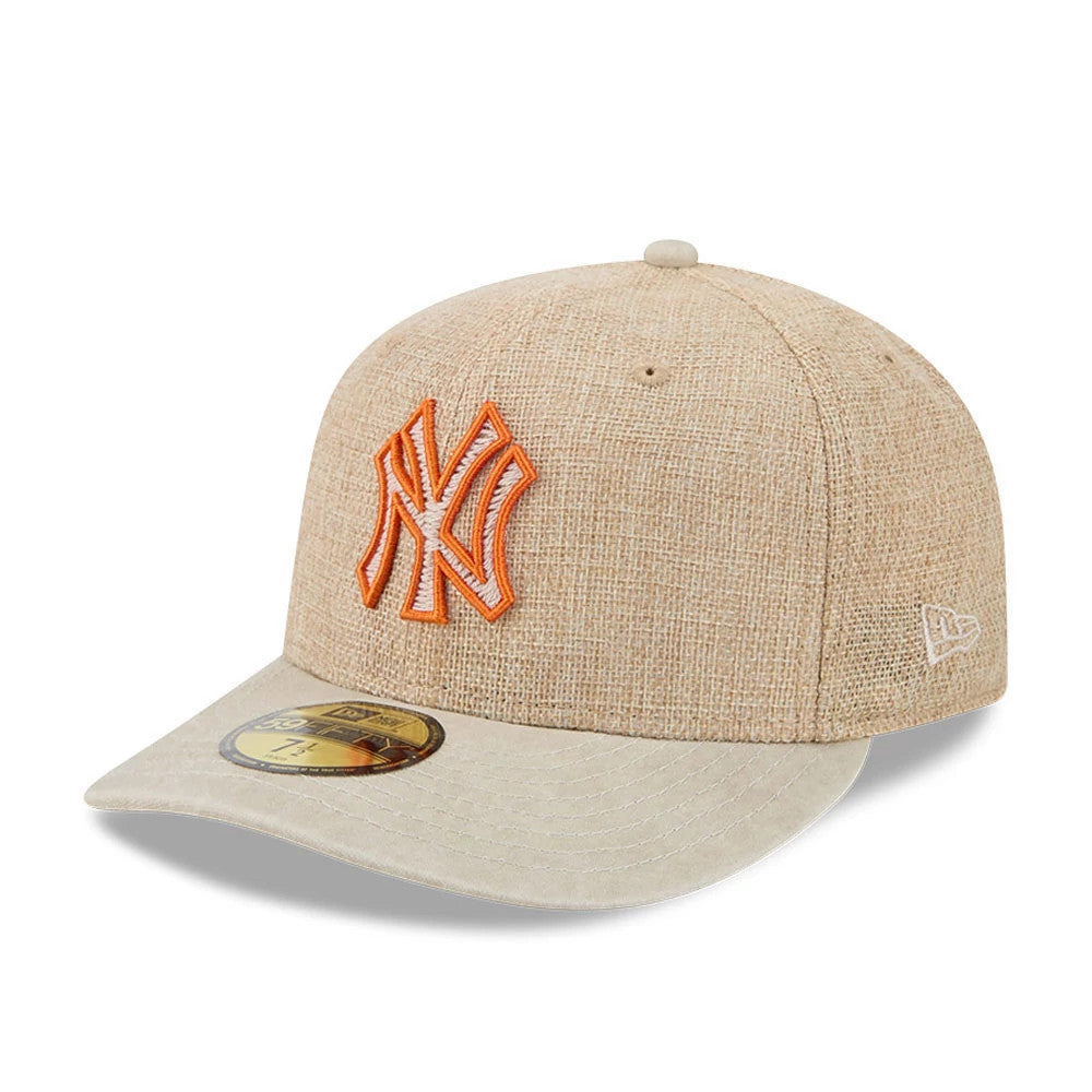 New York Yankees MLB Halloween Beige New Era 59FIFTY Fitted Cap, three-quarter view showing the orange embroidered NY logo on the front panel, with a contrasting beige visor and a gold 59FIFTY size sticker on the visor.