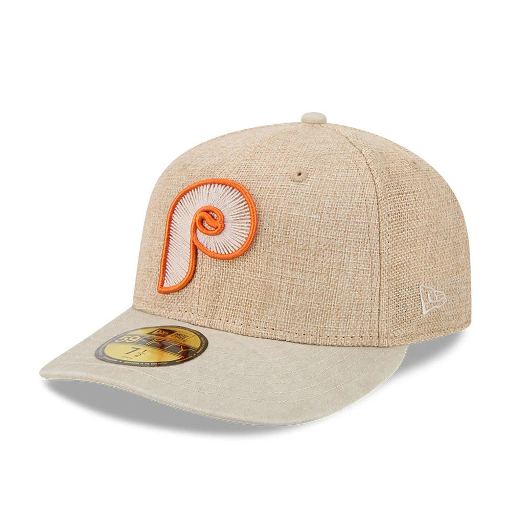 Philadelphia Phillies MLB Halloween Beige New Era 59FIFTY Fitted Cap, three-quarter view showing the raised orange and white embroidered P logo on the front panel, beige curved visor with a gold 59FIFTY size sticker.