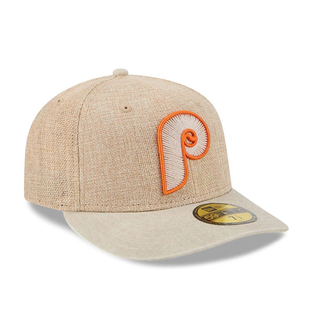Philadelphia Phillies MLB Halloween Beige New Era 59FIFTY Fitted Cap, three-quarter view showing the orange and white embroidered Phillies logo on the front panel, a matching beige flat visor, and a gold 59FIFTY size sticker on the visor.