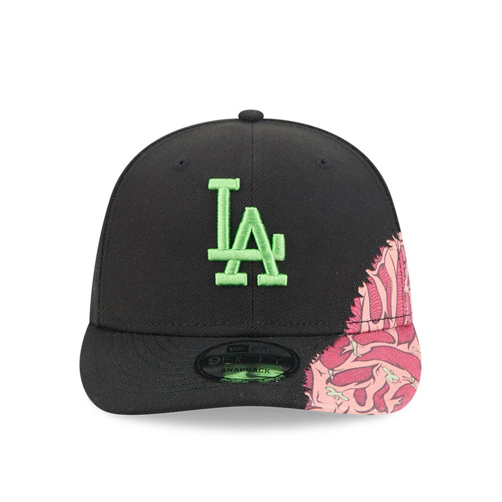 LA Dodgers MLB Halloween Black New Era 9FIFTY Snapback Adjustable Cap, front view showing a neon green embroidered LA logo on the front panel, a black flat visor with a 9FIFTY size sticker, and pink graphic on the right side.