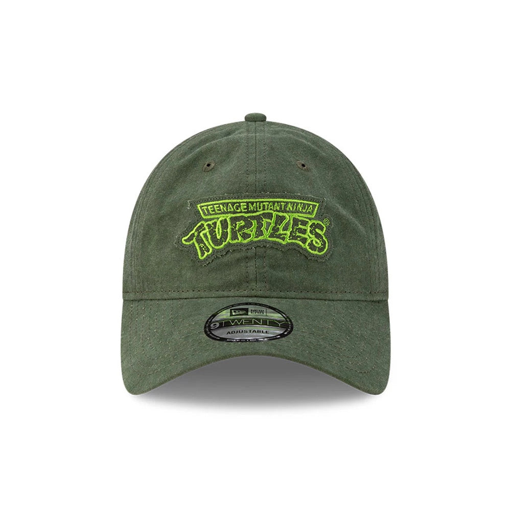 Teenage Mutant Ninja Turtles Dark Green New Era 9TWENTY Adjustable Cap, front view showing bright green embroidered logo centred on the structured dark green crown, with eyelets and a 9TWENTY size sticker on the curved visor.