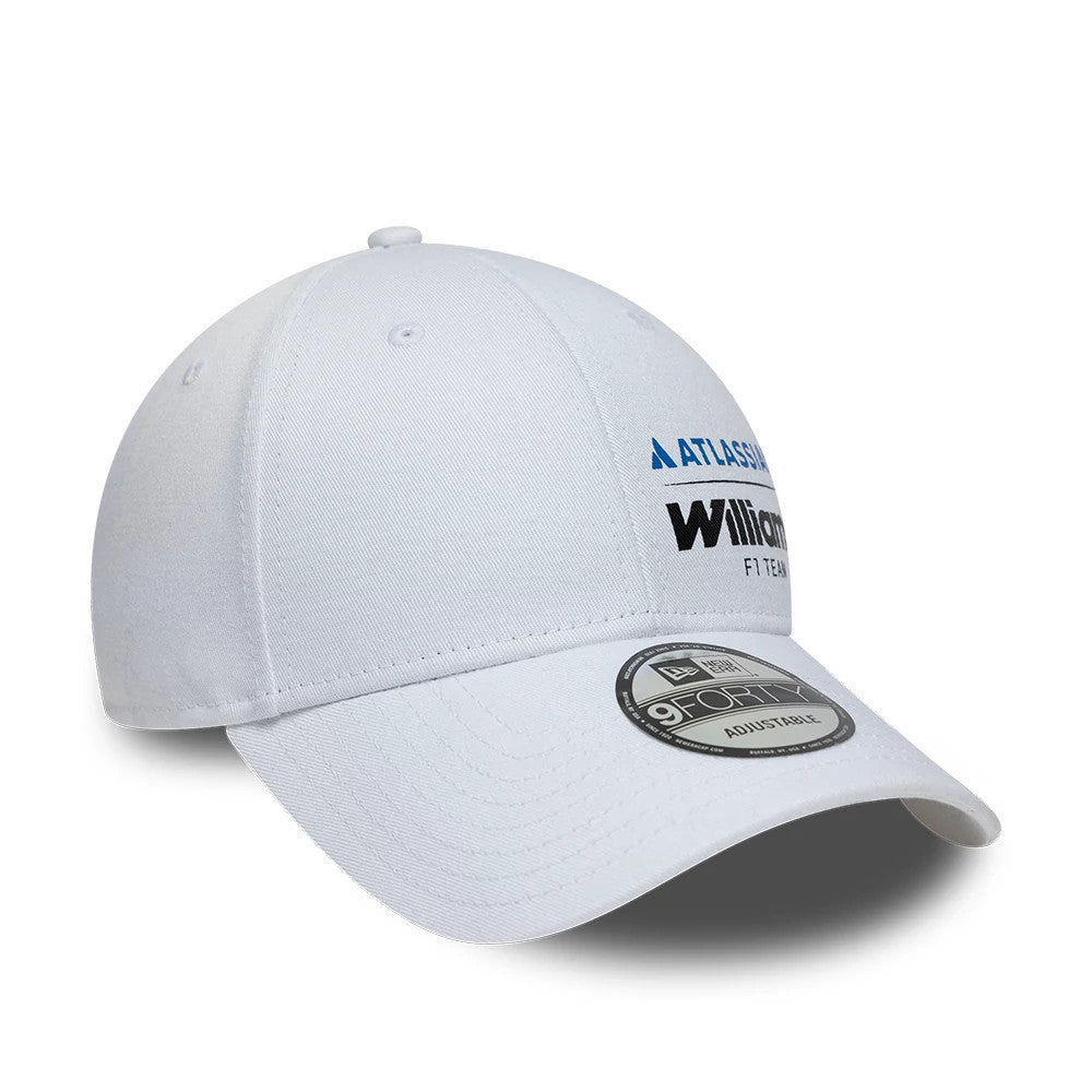 Williams Essential White New Era 9FORTY Adjustable Cap, three-quarter view showing the front panel with raised black and blue embroidered Williams logo, a white curved visor, and a 9FORTY size sticker on the top.