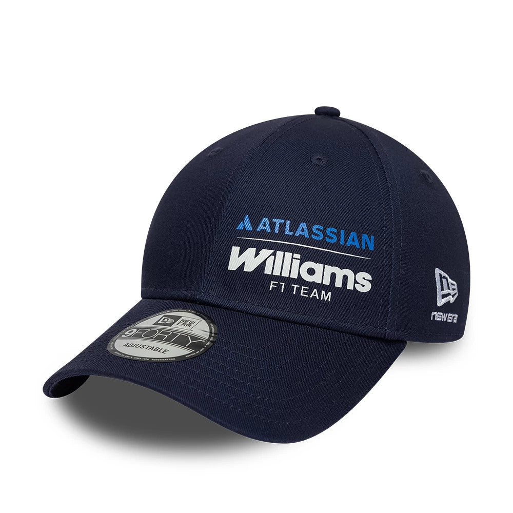 Williams Essential Navy New Era 9FORTY Adjustable Cap, three-quarter view showing the embroidered blue Atlassian text and white Williams F1 Team logo on the front panel, curved visor with a 9FORTY size sticker.