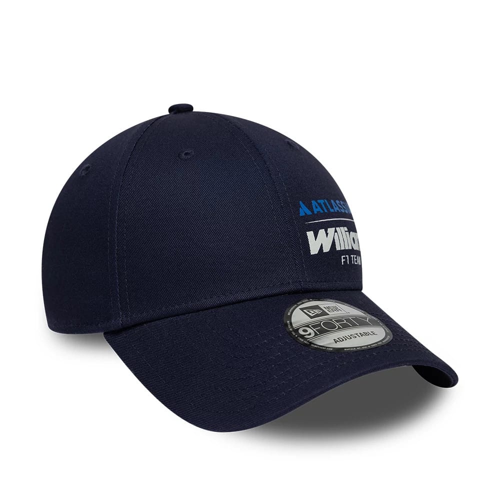 Williams Essential Navy New Era 9FORTY Adjustable Cap, three-quarter view showing the white 'Williams F1 Team' embroidered logo on the front panel, complemented by a curved navy visor and a 9FORTY size sticker on the top.