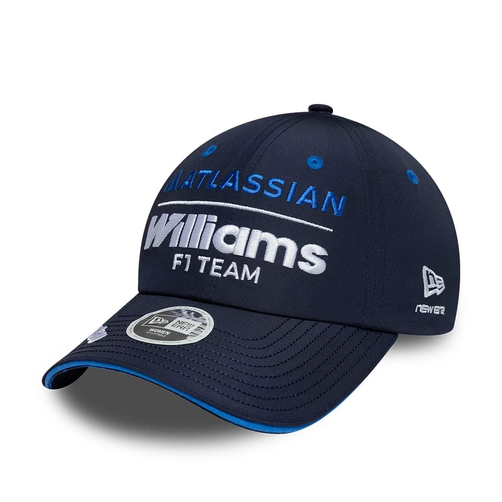 New Era Womens Williams Team Navy Open Back Cap, three-quarter view showing raised white and blue embroidered Atlassian and Williams F1 Team logos on the structured navy crown, curved navy visor with blue edge, and New Era flag logo on the left side.