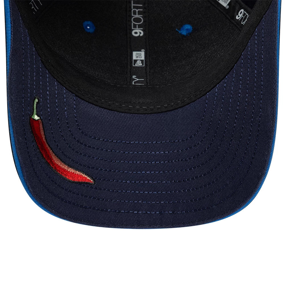 Youth Williams Carlos Sainz Navy New Era 9FORTY M-Crown Adjustable Cap, inside view featuring navy and blue taping with 9FORTY logos, a red and green embroidered chilli pepper on the navy undervisor, and blue eyelets on the black sweatband.
