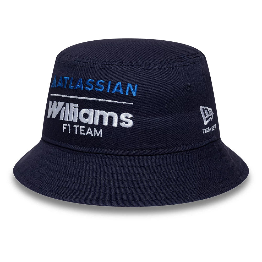 New Era Youth Williams Essential Navy Bucket Hat, front view showing the embroidered Atlassian and Williams F1 Team logos in blue and white on the navy crown, with the New Era flag logo in white on the left side.