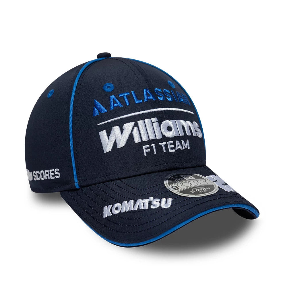 Youth Williams Alex Albon Navy New Era 9FORTY M-Crown Adjustable Cap, three-quarter view showing raised white Williams F1 Team logo on front panel, contrasting blue top button and eyelets, and 9FORTY size sticker on the navy curved visor.