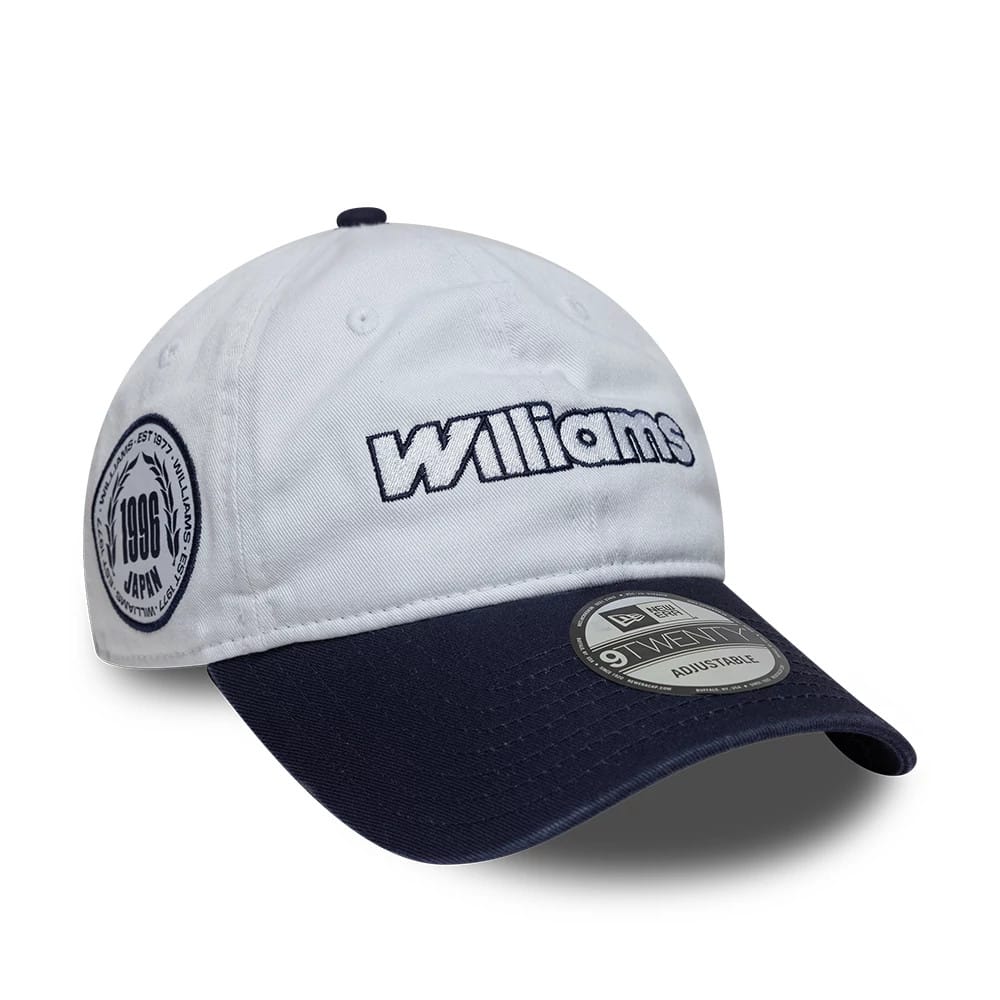 Williams Suzuka Race Special White New Era 9TWENTY Adjustable Cap, three-quarter view showing the embroidered Williams logo on the front panel, a navy visor with a 9TWENTY size sticker, and a circular badge on the side.