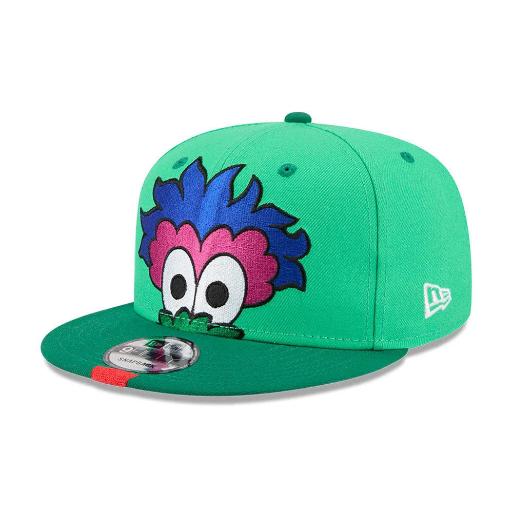 Phillies MLB All Star Game Bright Green New Era 9FIFTY Snapback Adjustable Cap, three-quarter view showcasing a colourful mascot face with large embroidered eyes on the front panel, a bright green visor, and the New Era flag logo on the left side.