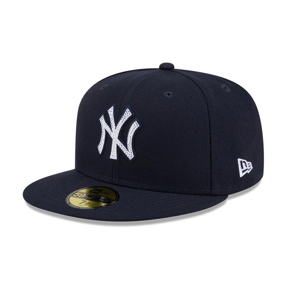 New York Yankees MLB Rhinestone Badge Navy New Era 59FIFTY Fitted Cap, front view showing the distinctive white NY logo outlined with rhinestones on the navy blue front panel, with a gold 59FIFTY size sticker on the flat visor.