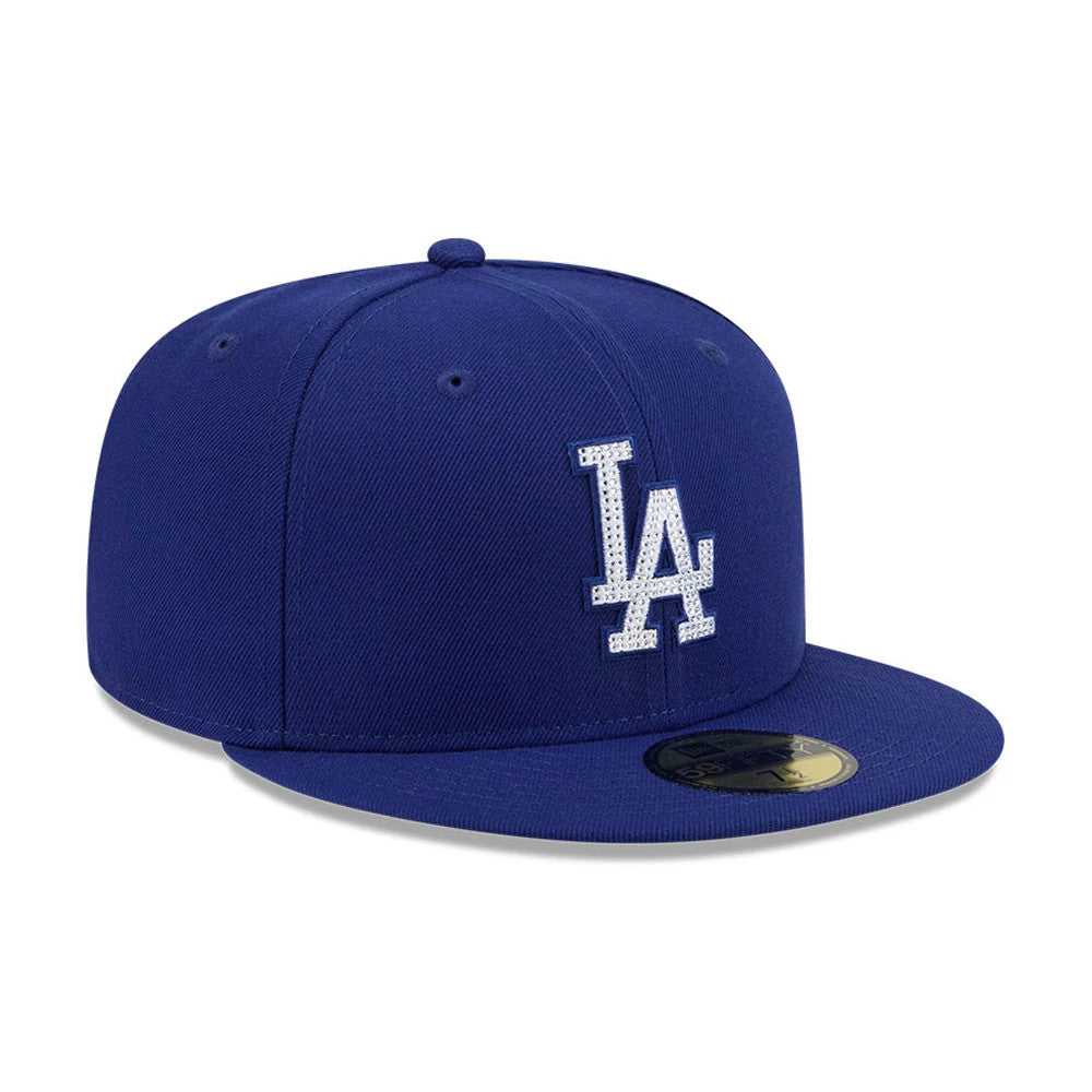 LA Dodgers MLB Rhinestone Badge Dark Blue New Era 59FIFTY Fitted Cap, three-quarter view showing a white LA logo with rhinestone on the front panel, a dark blue flat visor, and a gold 59FIFTY size sticker.