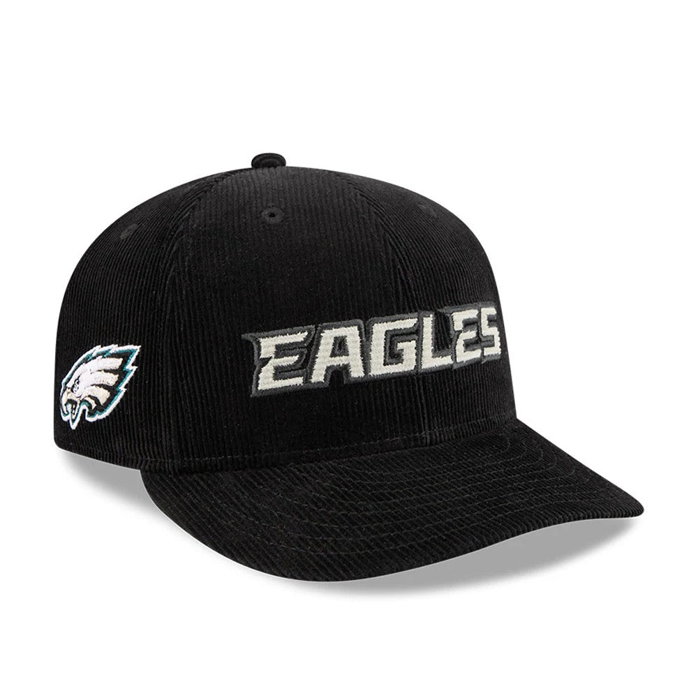 Eagles NFL 2 Tone Cord Black New Era 9FIFTY Snapback Adjustable Cap, three-quarter view showing the white embroidered Eagles wordmark on the front panel, with a team logo patch on the left side and a black corduroy visor.