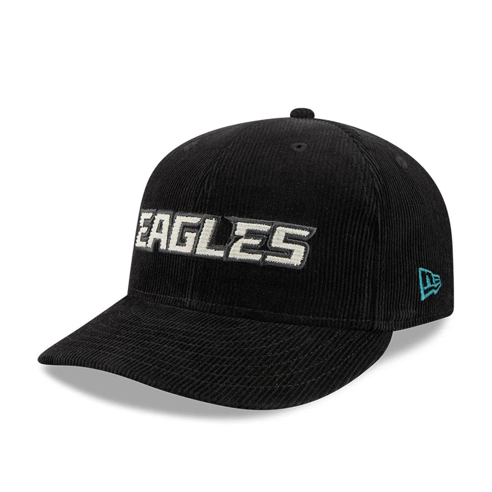 Eagles NFL 2 Tone Cord Black New Era 9FIFTY Snapback Adjustable Cap, three-quarter view showing the raised white Eagles logo embroidered on the front black corduroy panel, with a black curved visor and the cyan New Era flag logo on the left side.