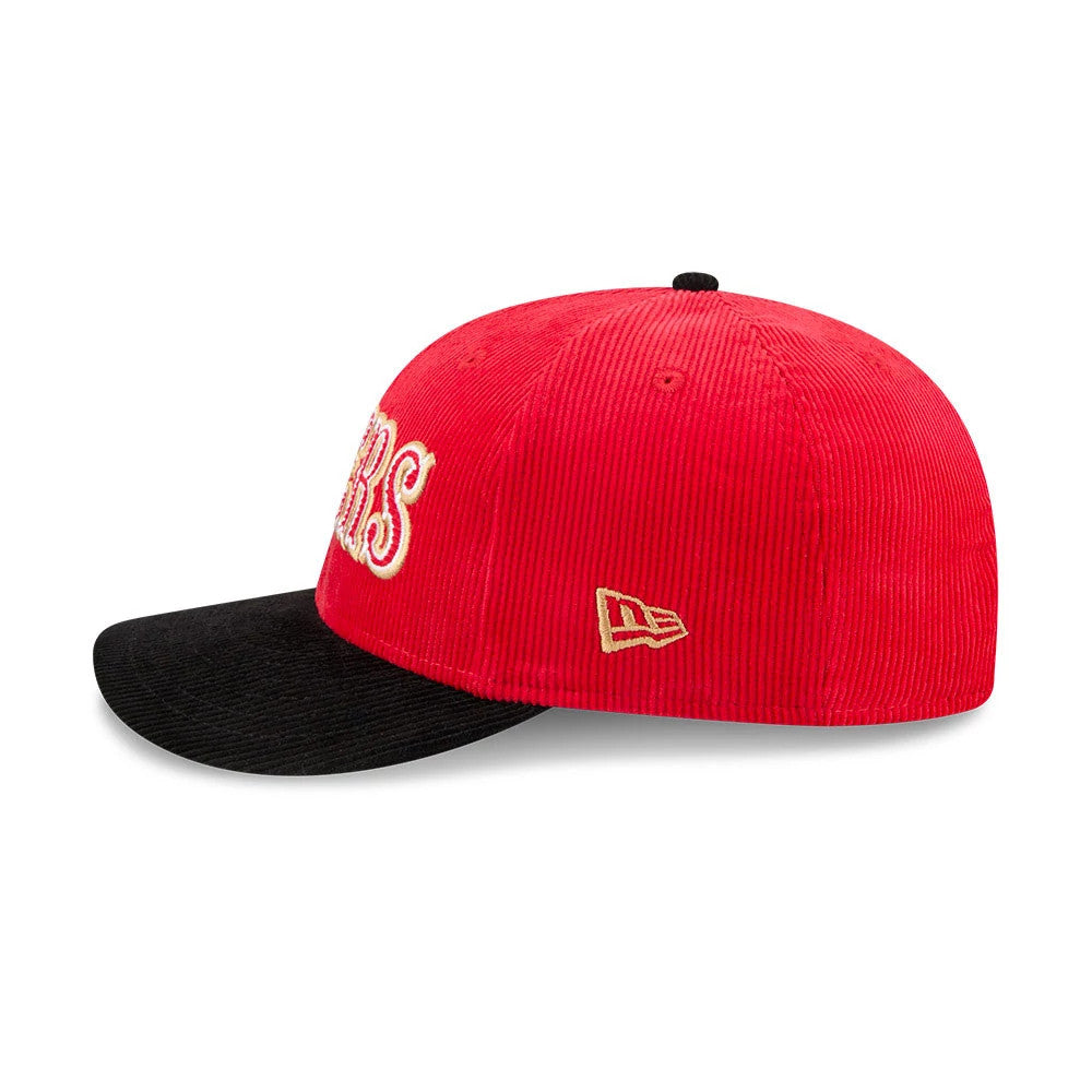 San Francisco 49ers NFL 2 Tone Cord Red & Black New Era 9FIFTY Snapback Adjustable Cap, side view showing the gold embroidered New Era flag logo on the left side of the red corduroy crown and the contrasting black visor.