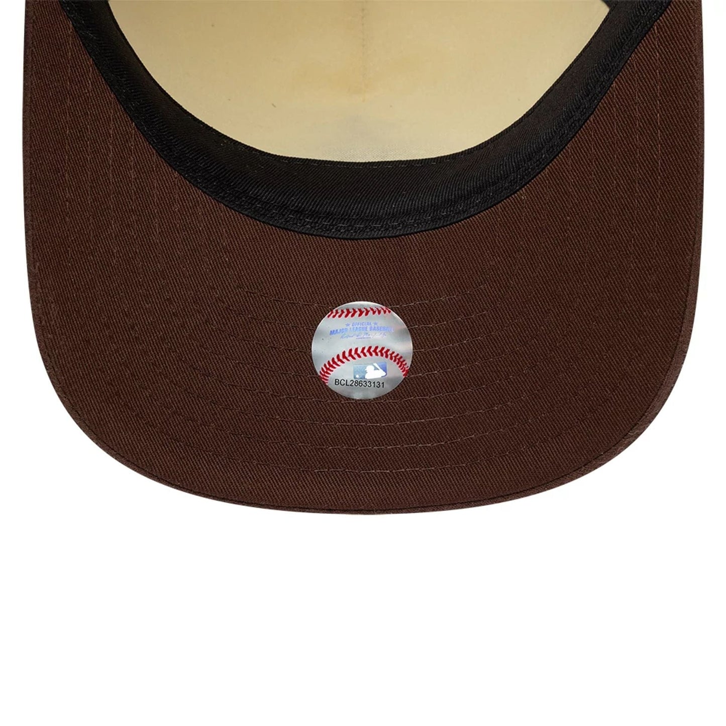 LA Angels MLB Suede Visor Cream New Era 9FIFTY A-Frame Adjustable Cap, inside view showing a cream undervisor, black internal sweatband, and a baseball-shaped sticker beneath the brown visor.