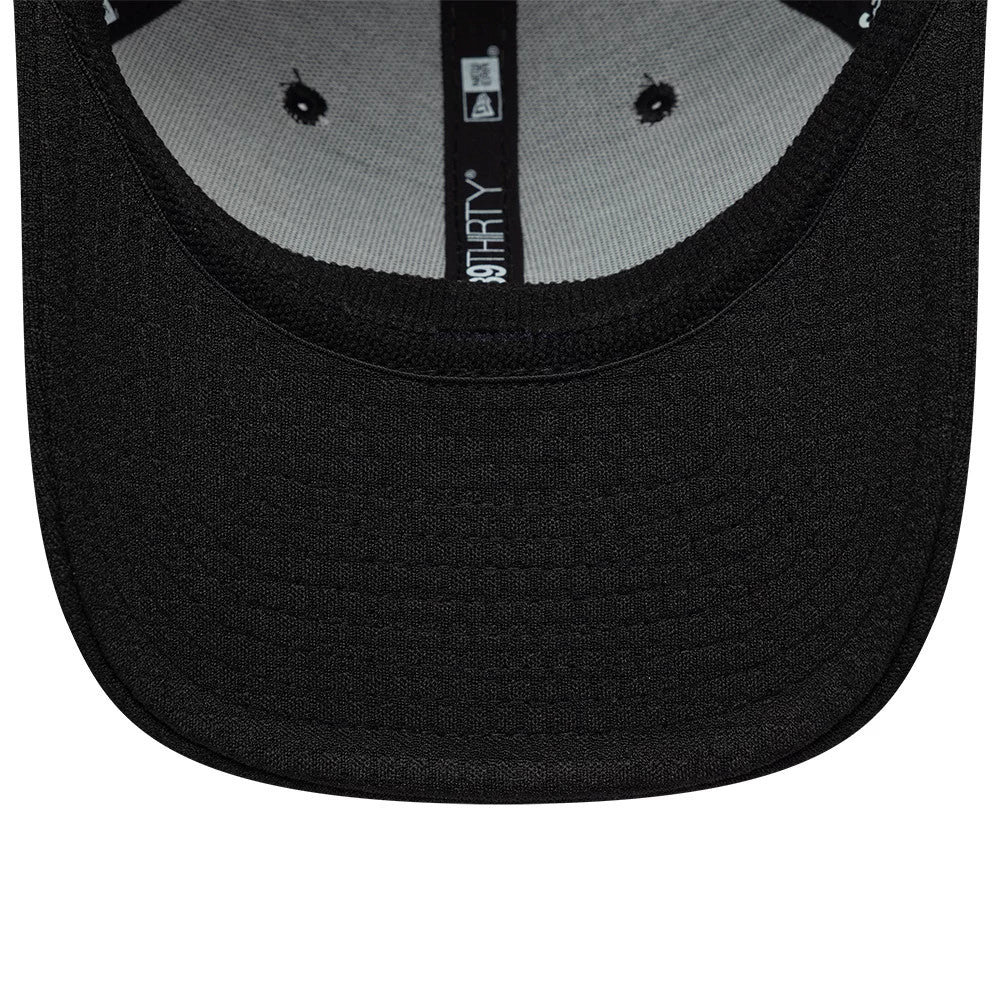 New Era Tech Black 39THIRTY Stretch Fit Cap, inside view showing the black undervisor, grey fabric interior with black eyelets, and the 39THIRTY logo embroidery on the black internal taping.