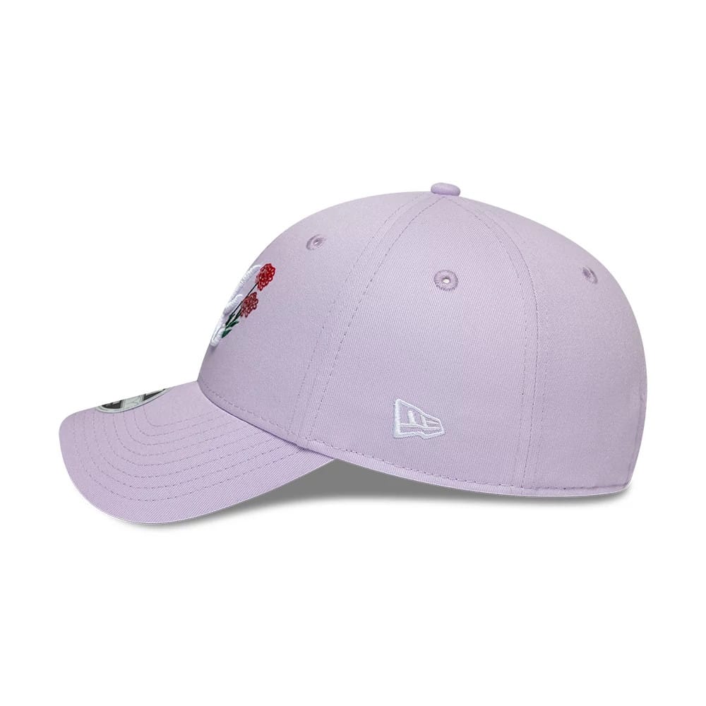 Atlanta Braves Womens MLB Floral Icon Pastel Purple New Era 9FORTY Adjustable Cap, side view showing the white embroidered New Era flag logo on the left side, curved visor, and part of a red floral design on the front panel.