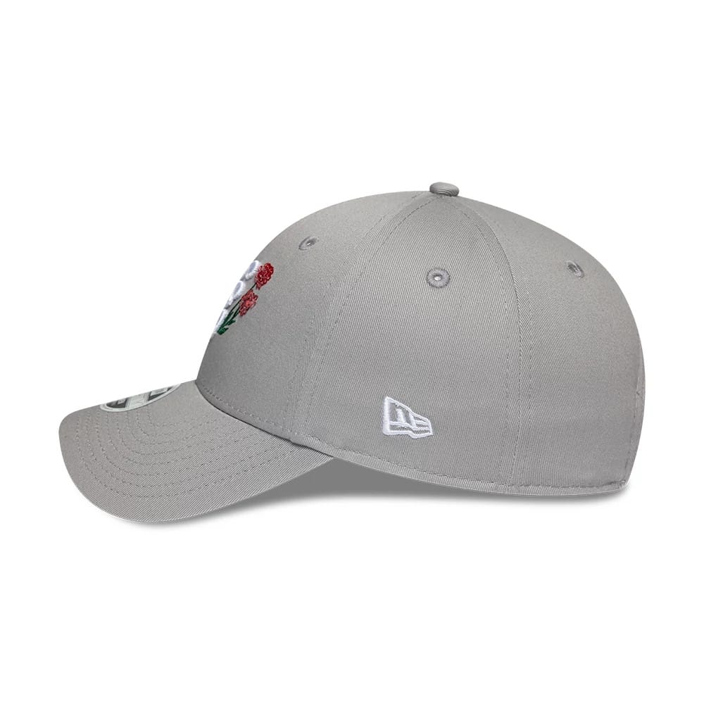 Womens New Era Floral Icon Grey 9FORTY Adjustable Cap, side view showing the embroidered white New Era flag logo on the left side, with a curved grey visor and floral embroidery on the front panel.