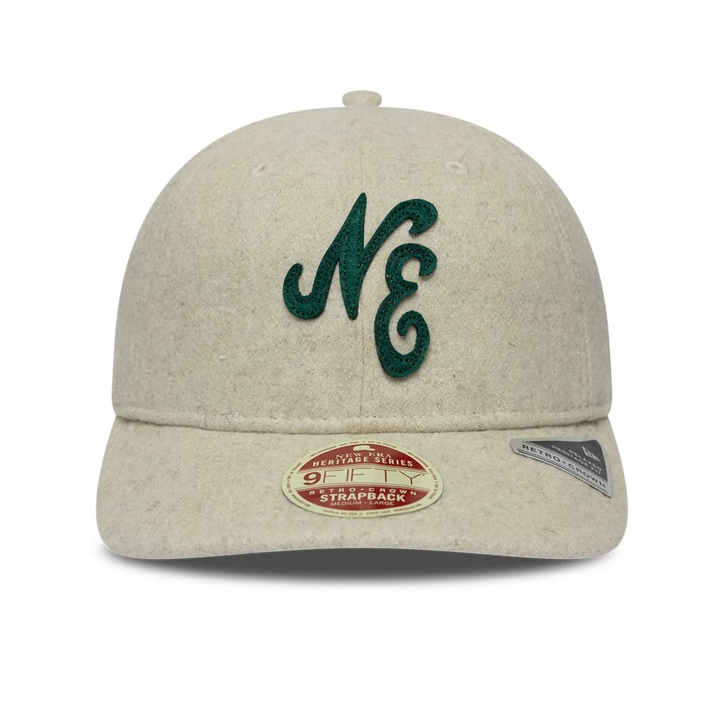 New Era Heritage Cream Retro Crown 9FIFTY Adjustable Cap, front view showing a dark green raised embroidered NE logo on the front panel, a curved cream visor with a 9FIFTY size sticker, and small side branding tab.