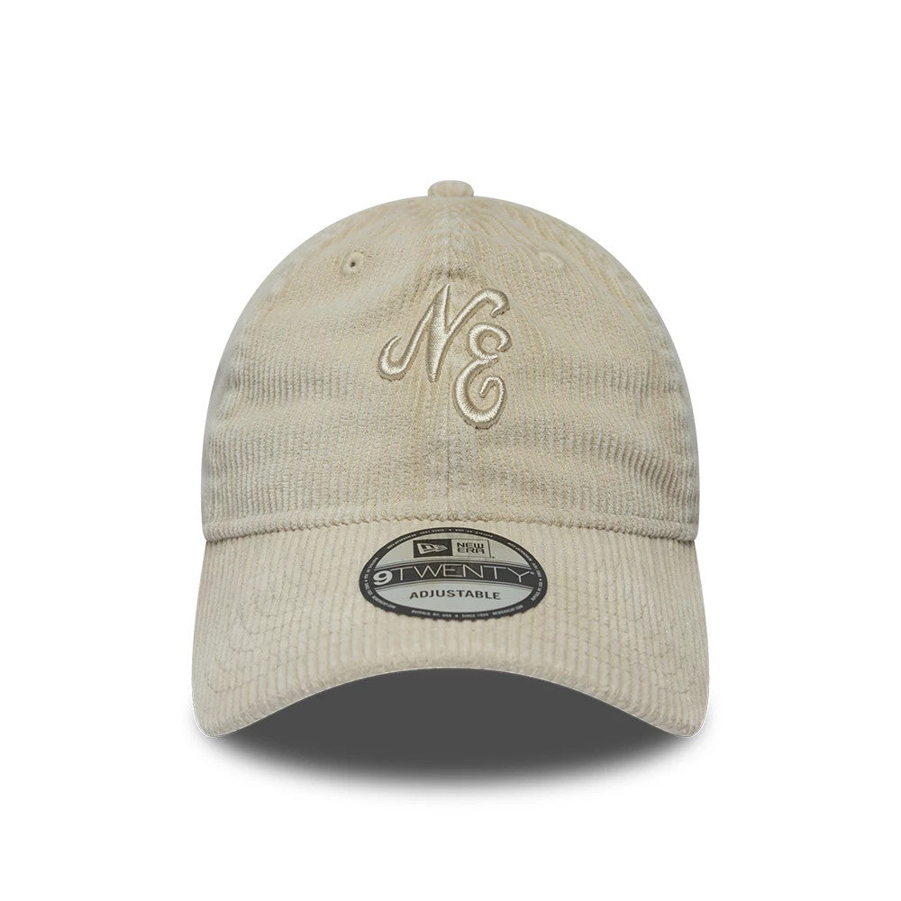 New Era Washed Cord Cream 9TWENTY Adjustable Cap, front view showing raised cream embroidery of the NE letters on the front panel, a curved cream visor with a 9TWENTY size sticker, and cord texture fabric throughout.