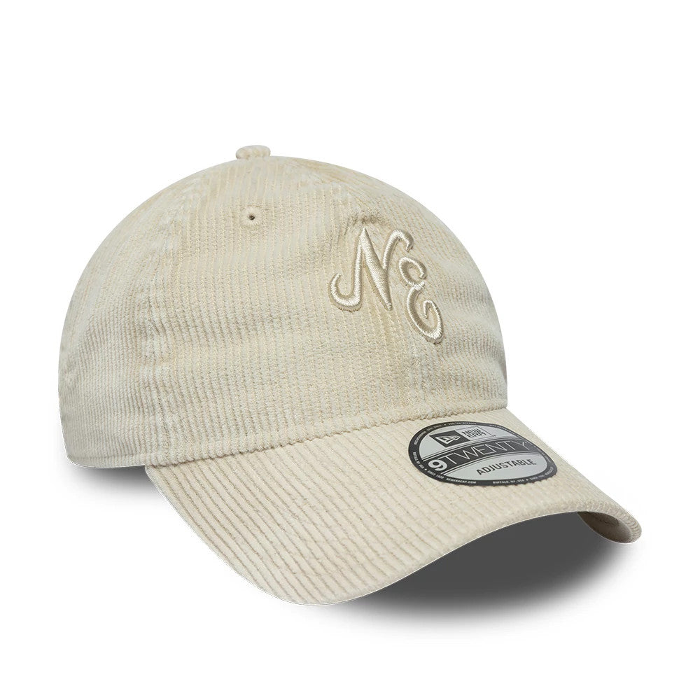 New Era Washed Cord Cream New Era 9TWENTY Adjustable Cap, three-quarter view showing the cream embroidered NE initials on the textured corduroy front panel, curved visor, and the 9TWENTY size sticker on the visor.