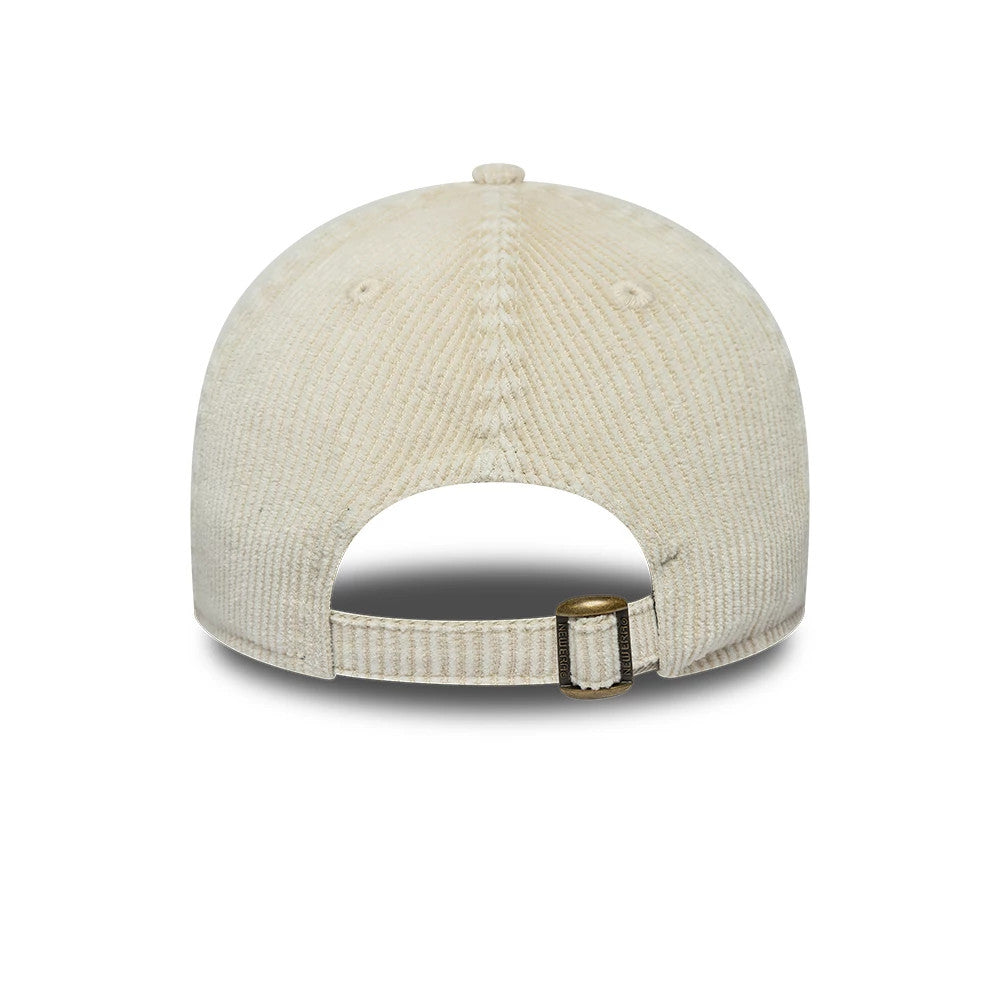 New Era Washed Cord Cream 9TWENTY Adjustable Cap, rear view showing the cream corduroy texture with a curved visor and a bronze buckle on the fabric strap at the back for size adjustment.