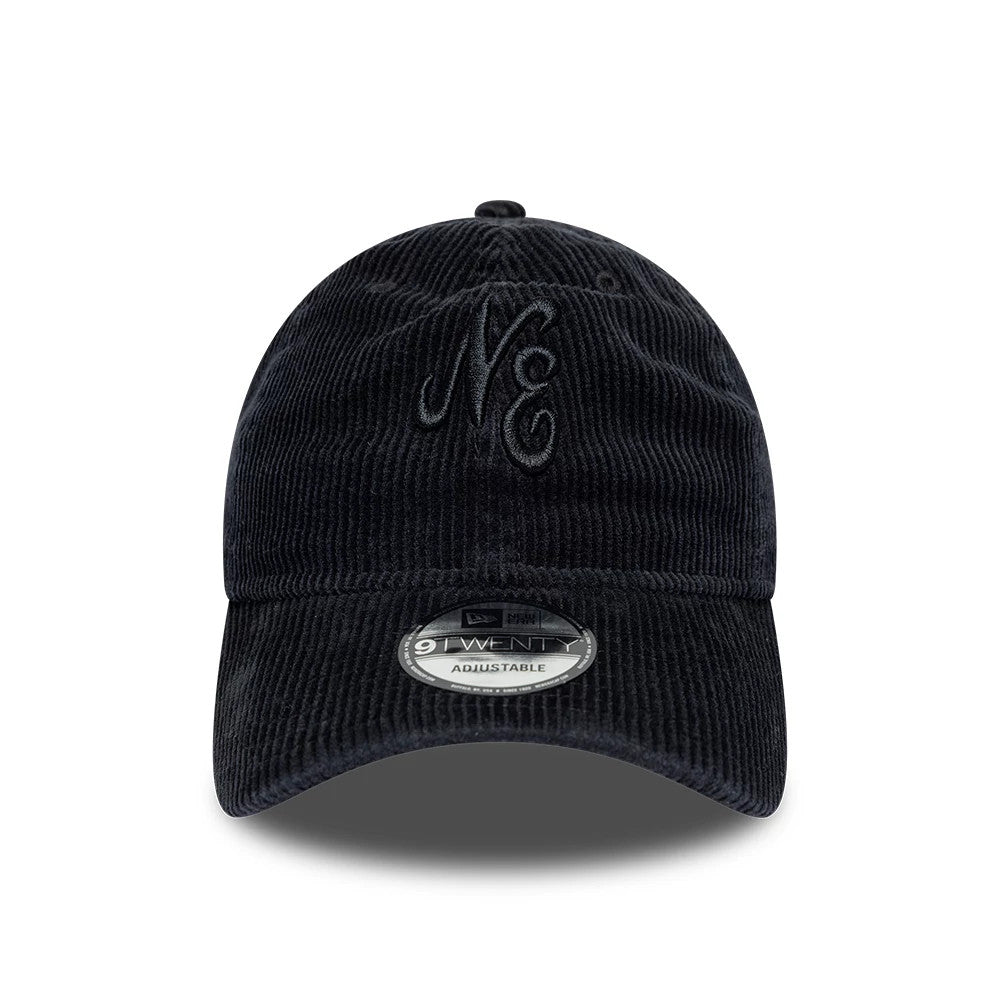 New Era Washed Cord Black 9TWENTY Adjustable Cap, front view showing the raised embroidery of the NE logo on the structured black corduroy crown, with a 9TWENTY size sticker on the curved visor.